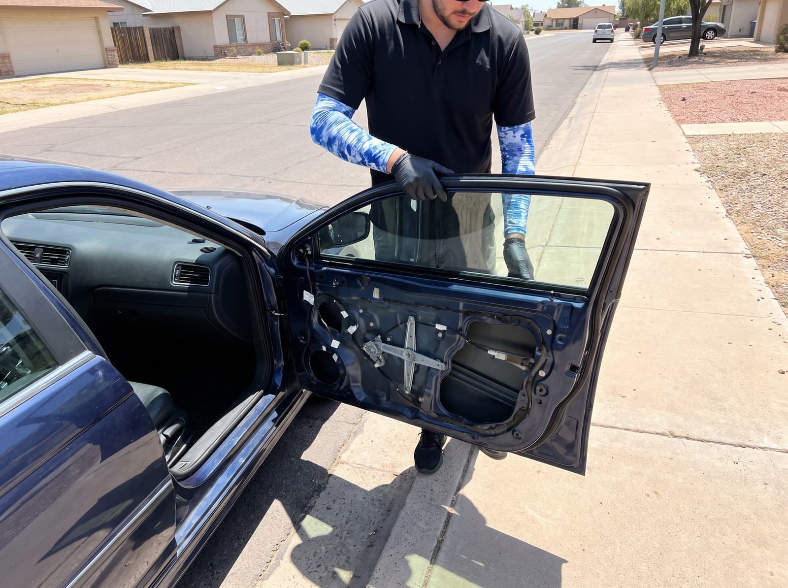 Door card removed and the new side glass lowered into the channel